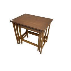 Mid-to late 20th century teak nest of three tables, rectangular top with shaped end supports
