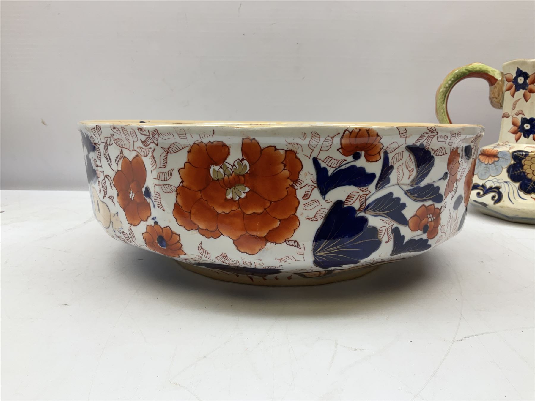19th century ironstone wash jug and bowl set decorated in the Imari palette, together with two further smaller ironstone jugs similarly decorated, bowl D35cm