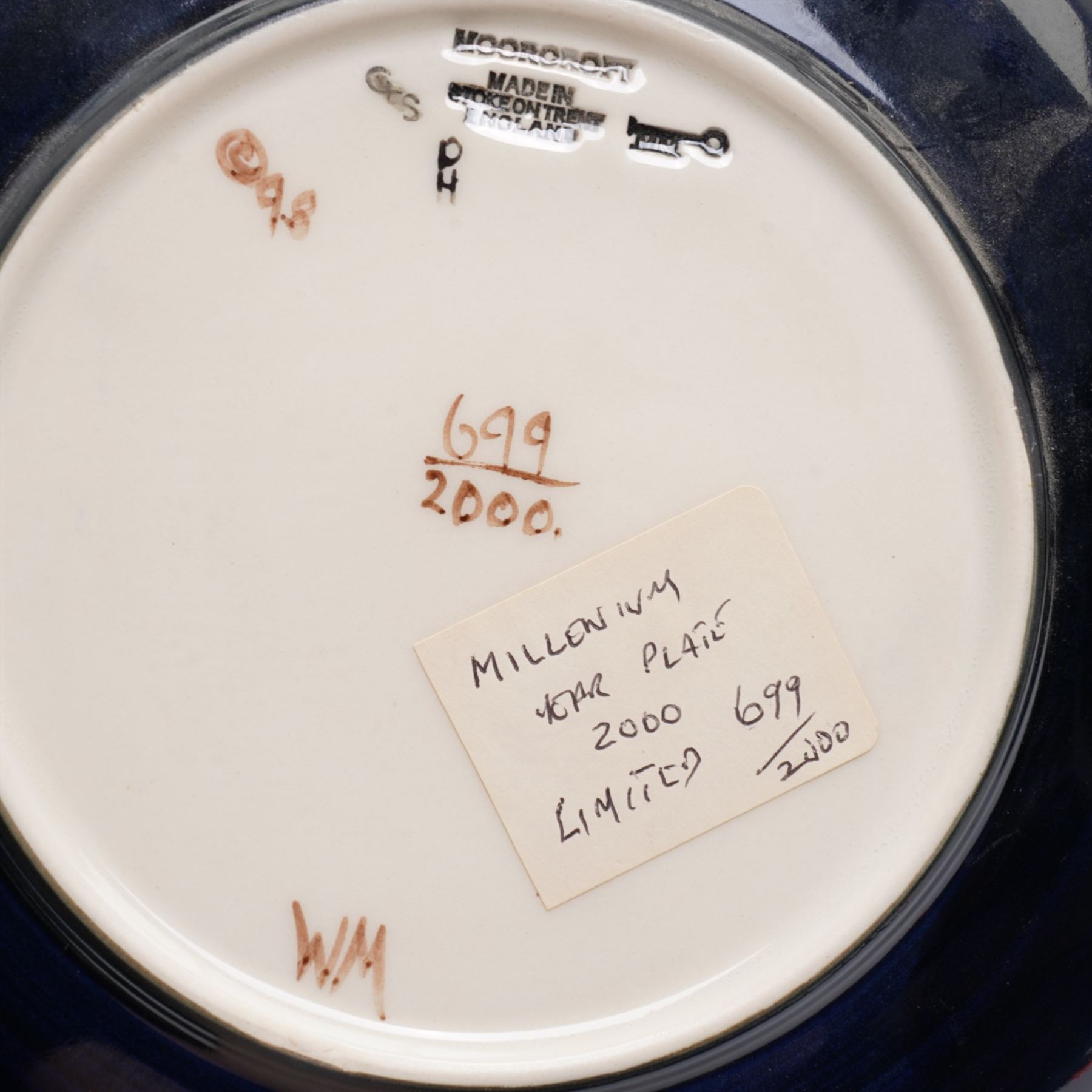 Moorcroft limited edition Birth of Light pattern millennium year plate, numbered 699/2000, impressed and painted marks to base; together with three other year plates comprising 1998, 1992 and Spitalfields Temple Mills edition 1991 plate (4)