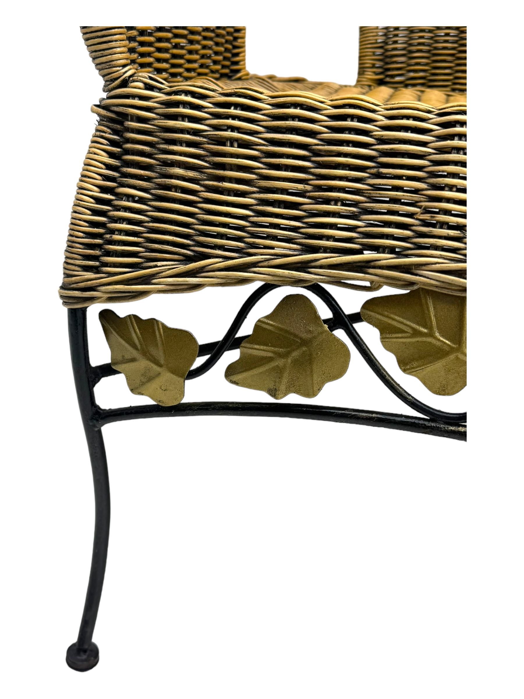 Late 20th century three-piece garden suite, wicker construction and wrought iron frame, decorated with cast metal leaf motifs, cream seat cushions and round back cushions