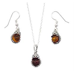 Silver Baltic amber hedgehog pendant necklace, stamped 925 and a pair of matching earrings