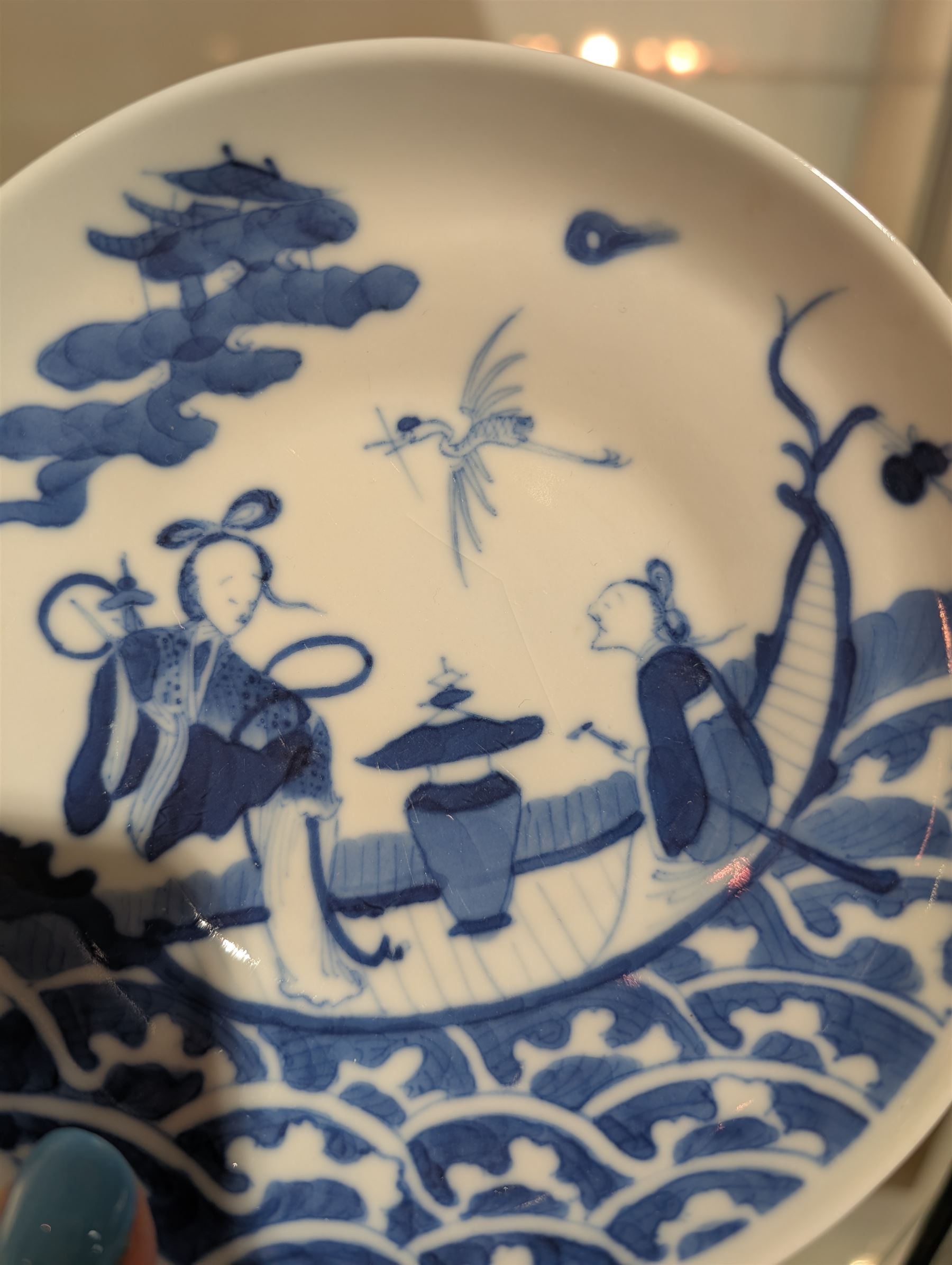 Pair of Chinese blue and white tea bowls, one with cover and four saucers, depicting two figures on a boat at sea, tea bowl H7cm