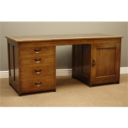 20th century oak twin pedestal desk, four graduating drawers, panelled cupboard, with 'School Furnishing Company Limited' transfer to side, W168cm, H76cm, D72cm  