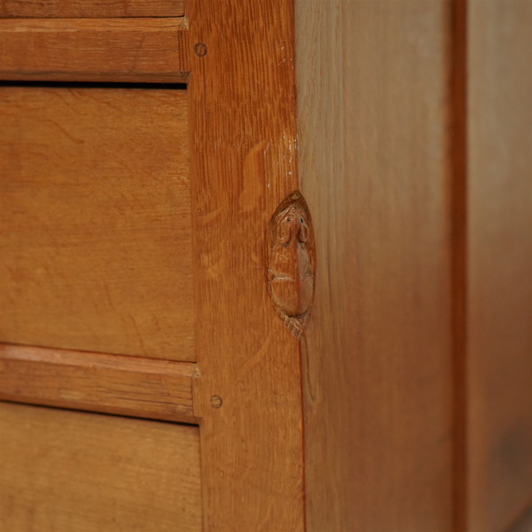 Mouseman - oak pedestal kneehole desk, adzed rectangular top over twin pedestals each fitted with three drawers, arched kneehole with panelled interior, on plinth base, signature carved mouse to side, by the workshop of Robert Thompson, Kilburn