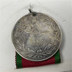 Victoria Crimea Medal with Sebastopol clasp awarded to G. Chammings H.M.S. Valorous; and a Turkish Crimea Medal, marked La Crimea 1855; both with later ribbons but original ribbons included (2)