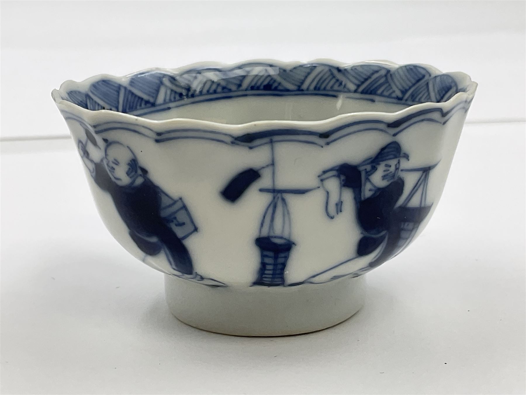 18th century Chinese blue and white Kangxi teacup and saucer, decorated with dancing figures, four character Kangxi mark beneath, saucer D10cm