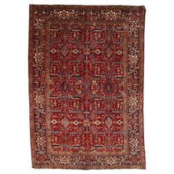 North West Persian Karadja hand-knotted carpet, deep red field decorated with an all-over ...