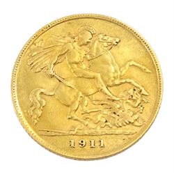 King George V 1911 gold half sovereign and a gold half sovereign 'Just in Case' pendant, hallmarked 9ct