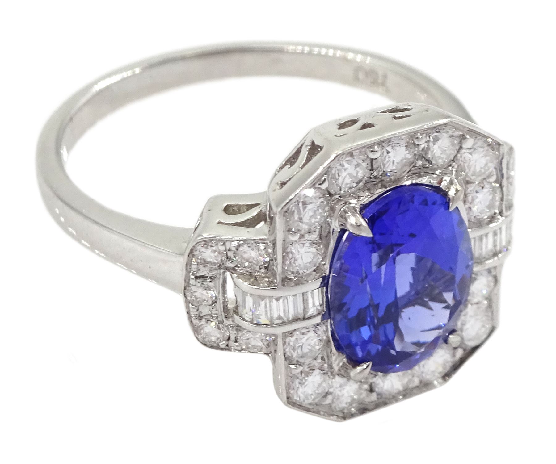 18ct gold oval tanzanite, round and baguette cut diamond cluster ring, stamped 750, tanzanite approx 1.85 carat, total diamond weight approx 0.70 carat