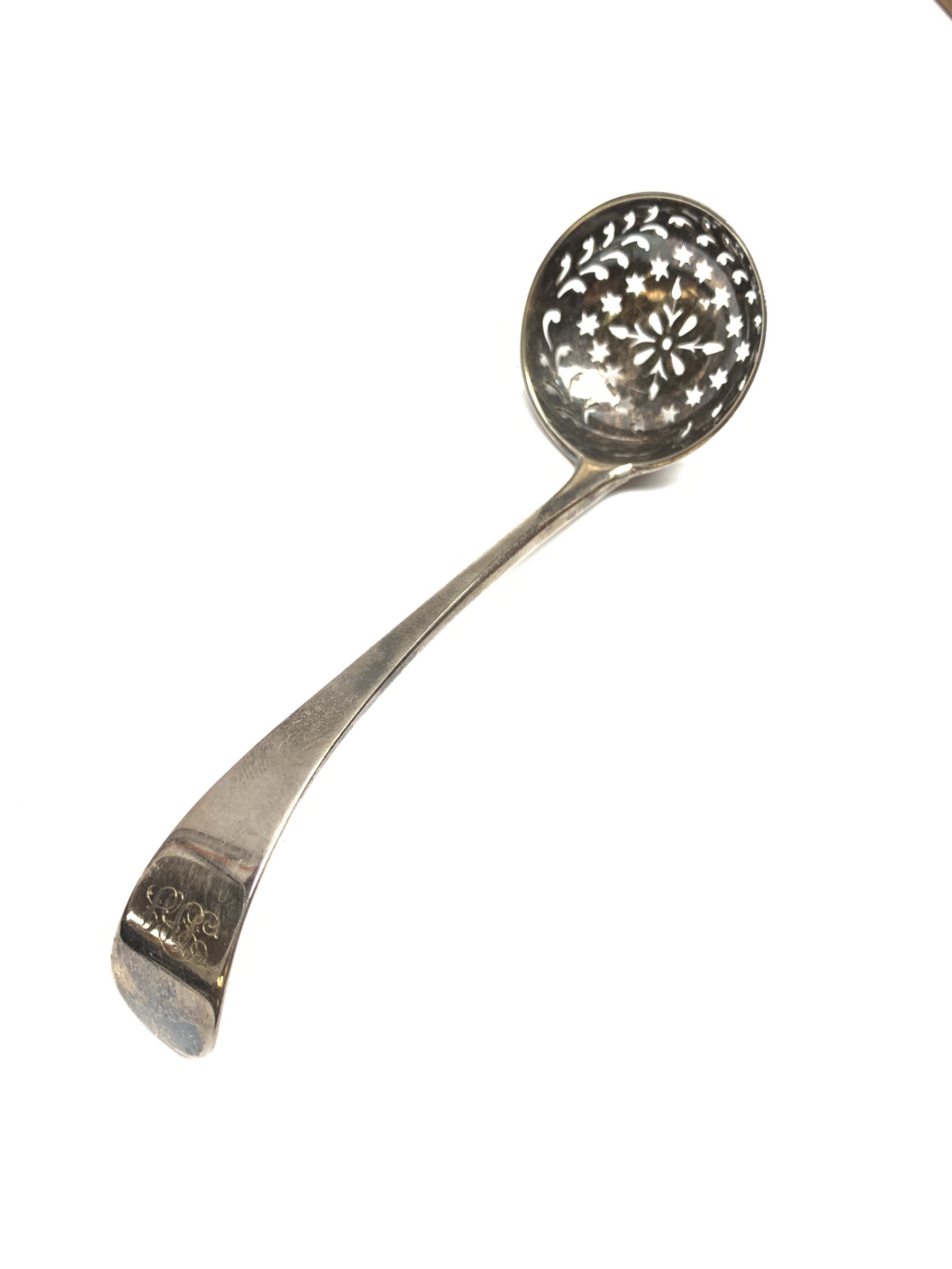 Late 19th/early 20th century composite canteen of silver flatware, contained within an early 20th century mahogany serpentine fronted case with twin drop carry handles, and hinged cover with boxwood stringing and central inlaid shell motif, above a single drawer with twin ring handles and Wellington style locking system, the cover and drawer opening to reveal plaque for Spink & Sons Ltd London, and fitted interior containing ivory handled knives, ivory handled carving set, and silver Hanoverian and Old English pattern cutlery, each with engraved monogram to terminal, hallmarked London, makers Spink & Son (John Marshall Spink), Goldsmiths & Silversmiths Co, and Chawner & Co (George William Adams), various dates ranging 1880-1923, gross weighable silver 92.59 ozt (2880 grams)