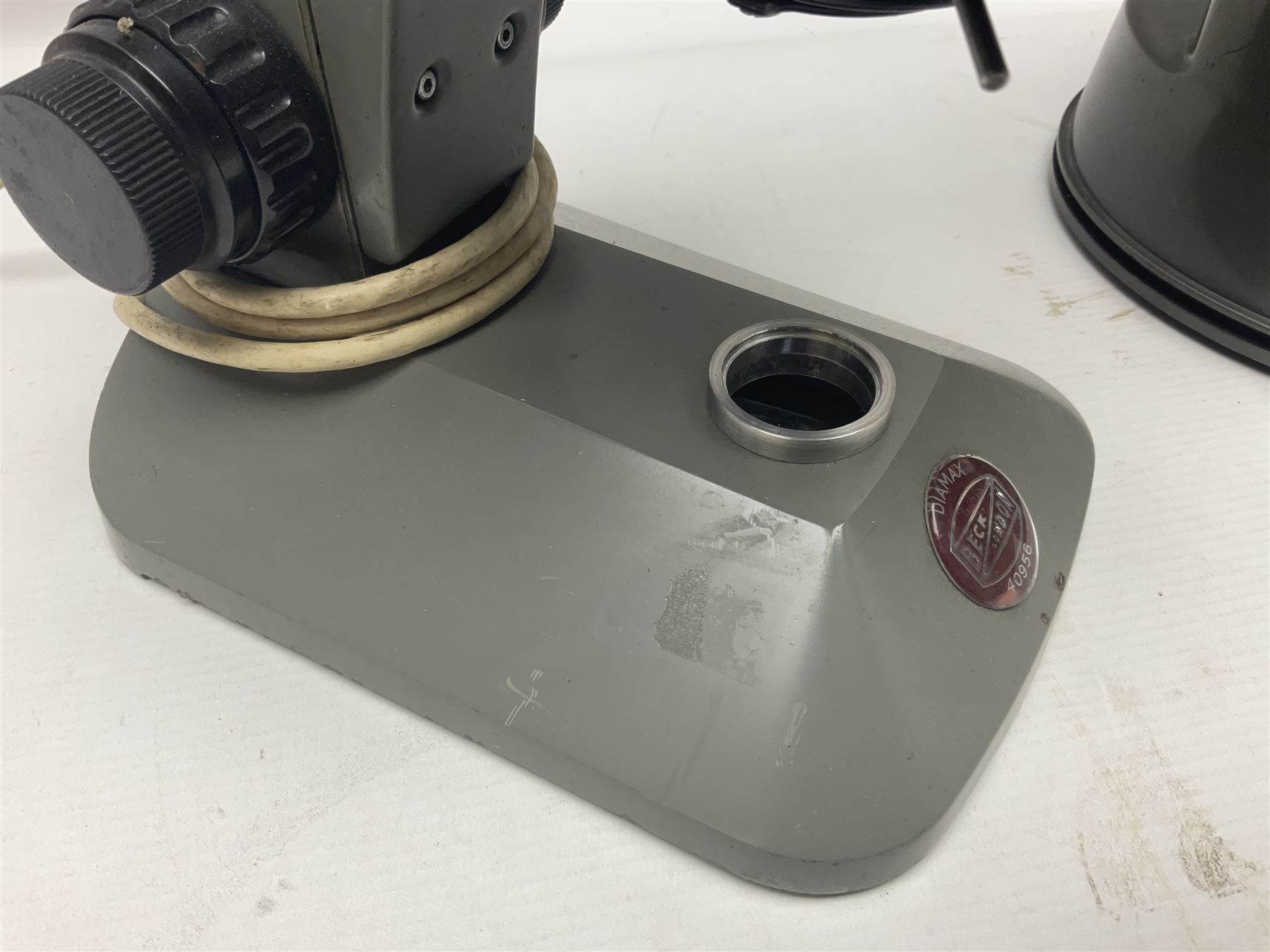 Four microscopes, comprising C Baker London Vickers, Back Diamax no 40956, Opax ABF no 232733 and one other 