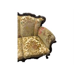 Victorian design stained wood three seater settee, top rail carved and scrolled, padded back and arms, scrolled cabriole feet 