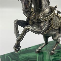 Modern silver model of a rearing horse, with ornate parcel gilt saddle and bridle, mounted upon a rectangular base, decorated with malachite panels to each side and upon four gilt bun feet, horse stamped 925, overall H14.5cm