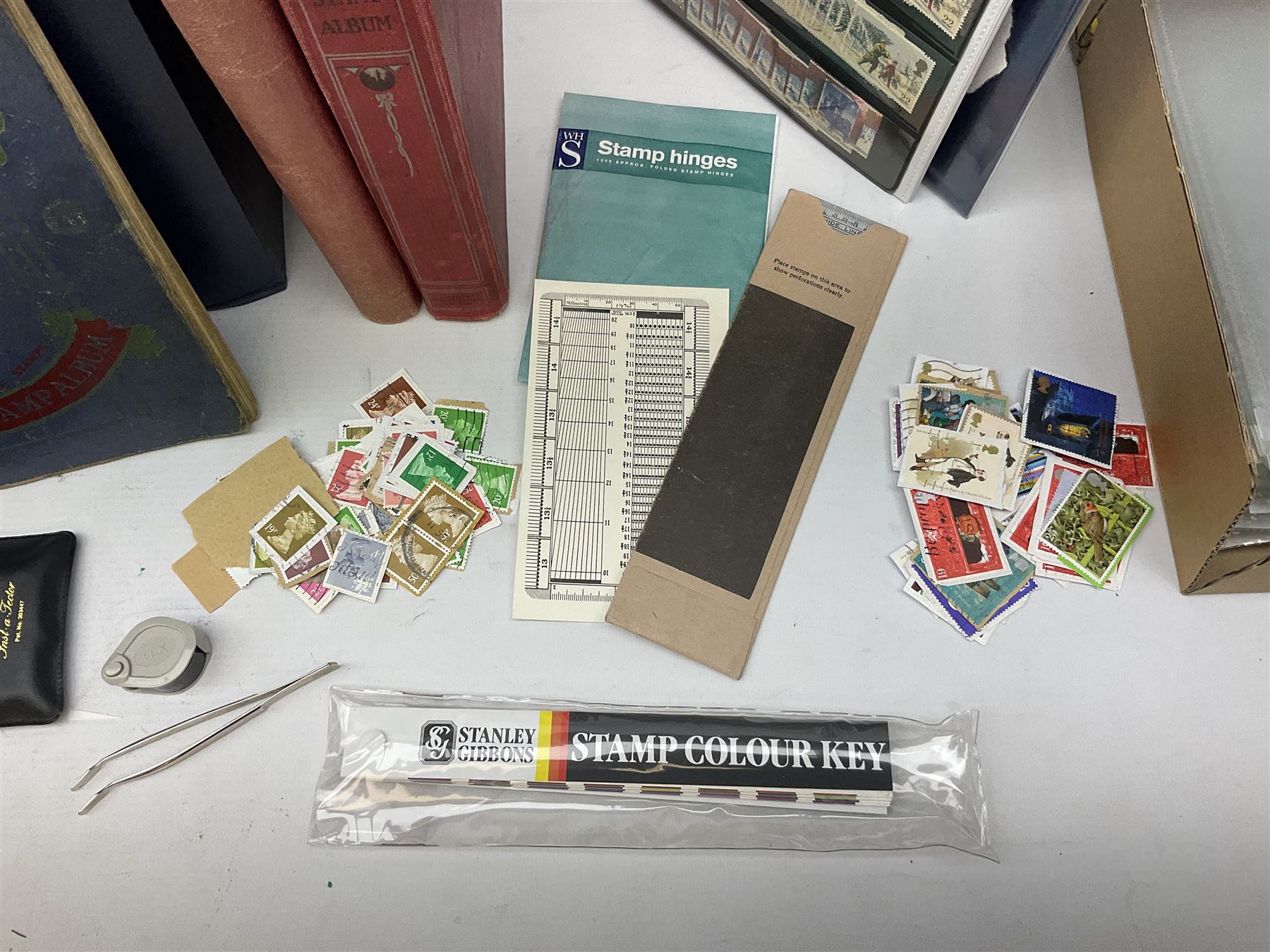 Great British and World stamps, including mostly used GB Queen Elizabeth II, New Zealand, Australia, Belgium, British Guiana, Canada, Chile, Cyprus, Denmark, Finland, Gambia, Germany, India, Liberia etc, stamp colour key, tweezers and various other stamp accessories, housed in various stockbooks, albums and loose, in one box