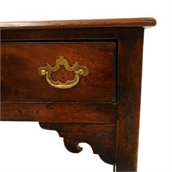 George III oak dresser base, rectangular top with moulded edge, fitted with two drawers over shaped spandrels, raised on square chamfered supports united by undertier, on stile feet
