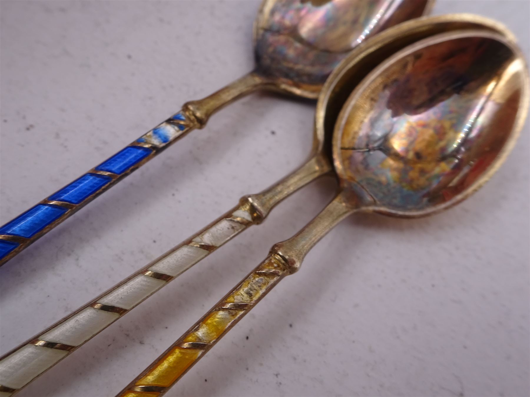 Set of six Danish silver gilt coloured guilloche enamel coffee spoons, each spoon with twist design enamel handle and ball finial, stamped Ela Denmark Sterling, in case