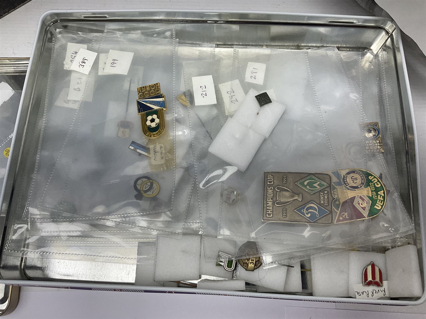 Large collection of approximately one hundred and eighty enamel badges and pins, relating to British and World football clubs, including loose examples and examples housed in folders, mostly identified