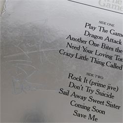 Queen 'The Game' signed vinyl record, signed to the reverse of the mirrored silver sleeve by Freddie Mercury, Roger Taylor and John Deacon, released by EMI records 1980

Provenance by vendor repute: Queen played at Elland Road in Leeds 29th May 1982; the vendor met the band the day before and had this record signed by the three members, but Brian May had not yet got off the train. The vendor called up the hotel and impersonated the band's then manager, Gerry Stickles, (by putting on an Australian accent!) to ask what time the band were arriving, then waited for them at the hotel.