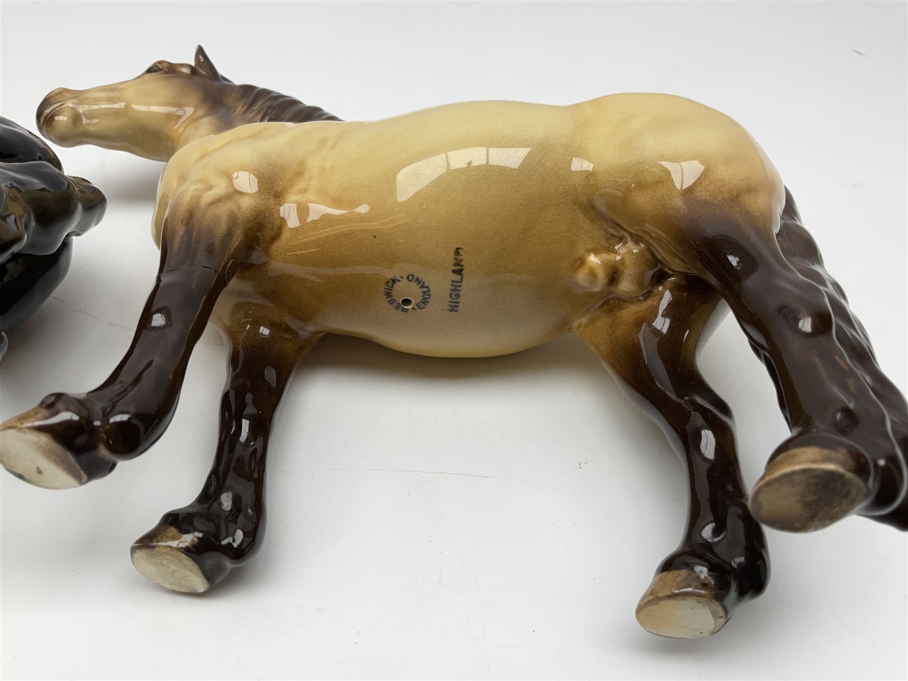 Beswick dun Highland pony no 1644 and piebald Pinto Pony  no 1373, both with printed mark beneath