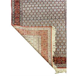 Fine Persian beige and red ground rug
