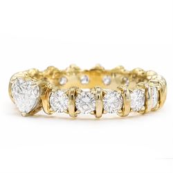 18ct gold diamond eternity ring, set with a single heart cut diamond of approx 0.50 carat and sixteen round brilliant cut diamonds, total diamond weight approx 1.95 carat
