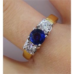 18ct gold three stone round sapphire and diamond ring, hallmarked, sapphire approx 1.10 carat, total diamond weight approx 0.40 carat