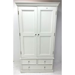 Pine painted wardrobe, projecting call Nice, two cupboard doors enclosing hanging rail above too short and one long draw, platform base