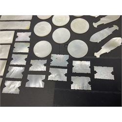 Collection of fifty seven Chinese mother of pearl gaming counters or tokens, of various size and form including rectangular, circular and fish shaped examples, various decoration including floral motifs, largest rectangular examples L6cm