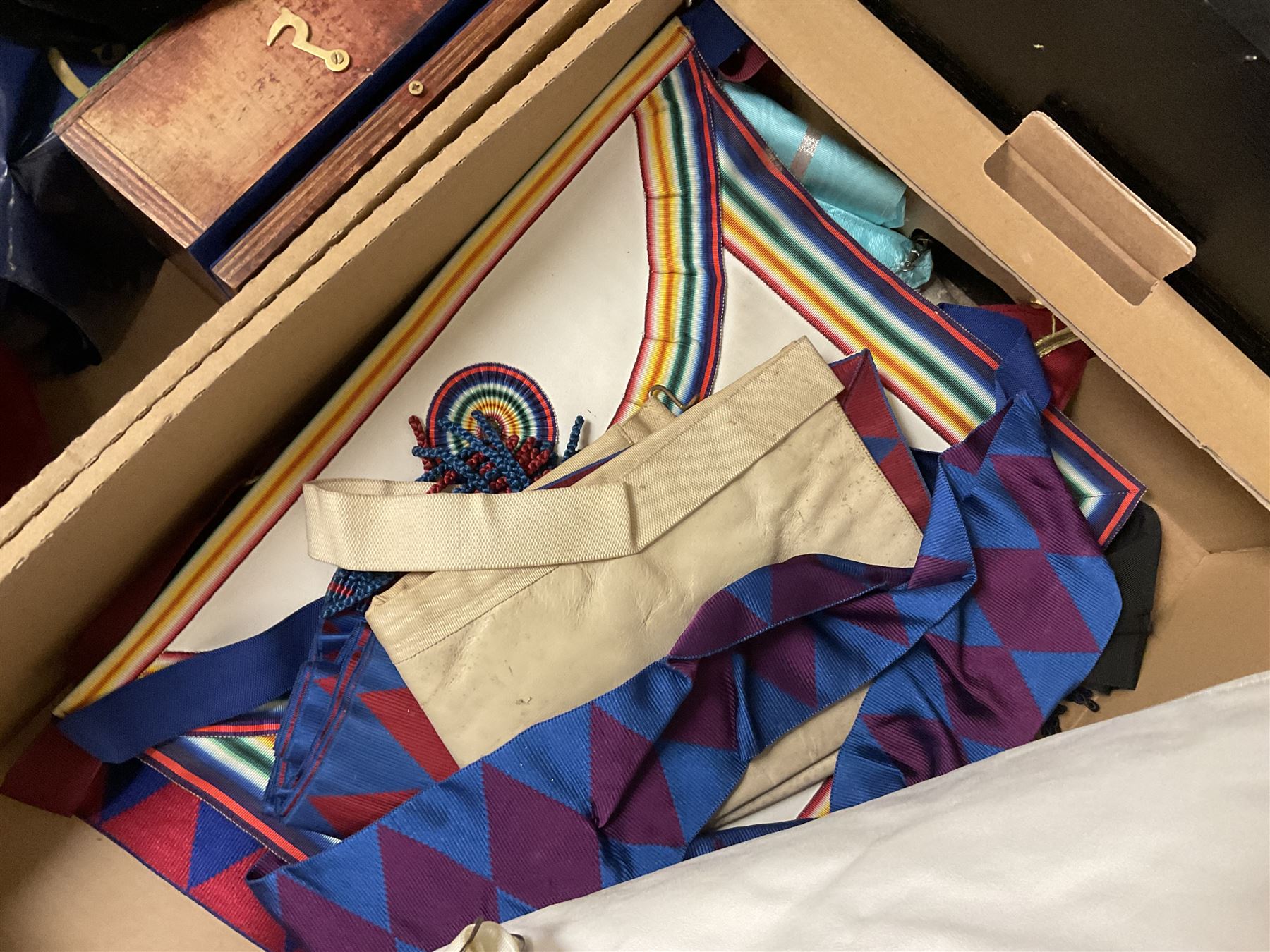 Masonic regalia, including sword, kid leather gloves and apron, Order of Holy Wisdom high priest mitre, etc, contained within briefcases and boxes 