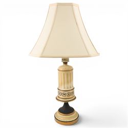 Pair of table lamps, the central column with gilt and and black bands and a foliate boarder, with cream shades, H58cm without shades 
