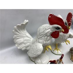 Pair of fighting cockerels from Italy together with three other ceramic cockerels, largest H30cm 