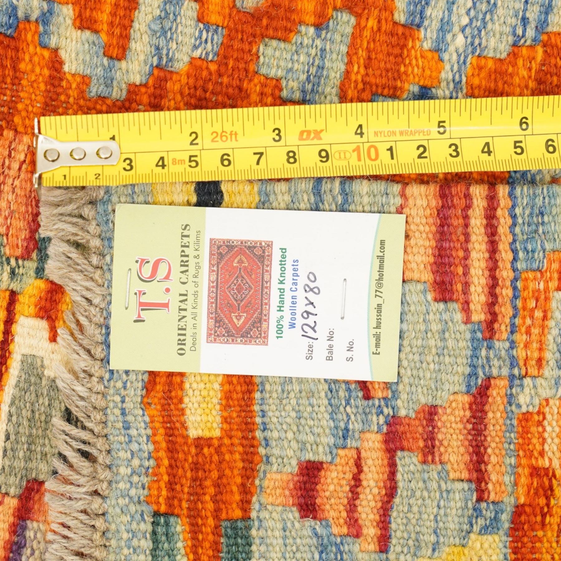 Afghan Chobi flatweave kilim and an Afghan Chobi flatweave kilim runner, with a repeating stepped diamond medallion design in ivory, green, rust, teal, purple, and indigo, framed by chevron and geometric borders, 148x53cm & 129x80cm, (2)