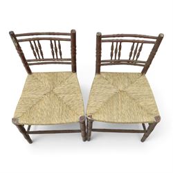 Pair of 19th century lacquered faux bamboo rush seated side chairs chairs, original blue paint under later ox-blood lacquer finish