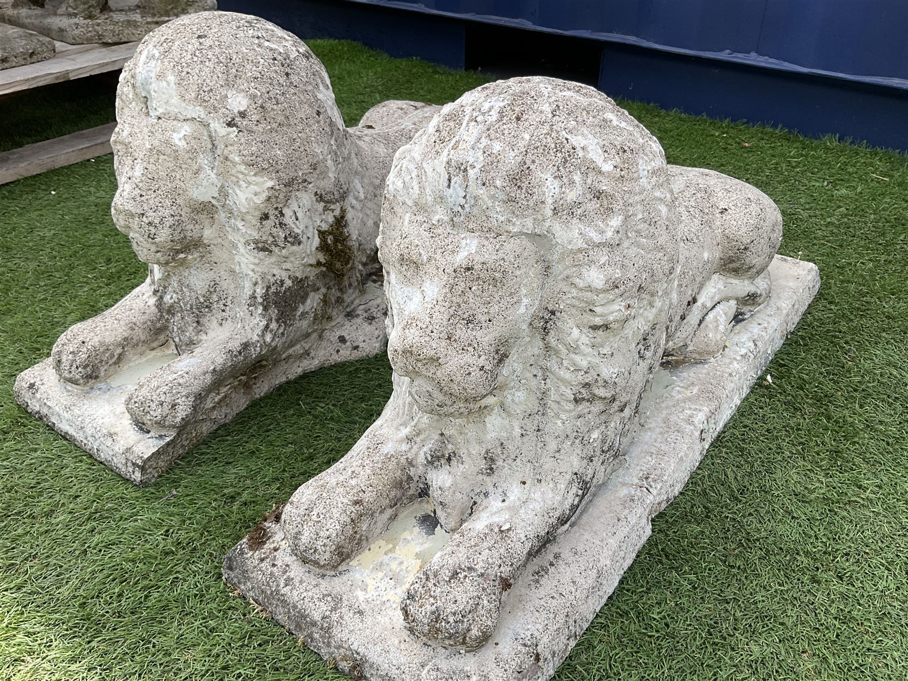 Pair composite stone garden recumbent lions - THIS LOT IS TO BE COLLECTED BY APPOINTMENT FROM DUGGLEBY STORAGE, GREAT HILL, EASTFIELD, SCARBOROUGH, YO11 3TX