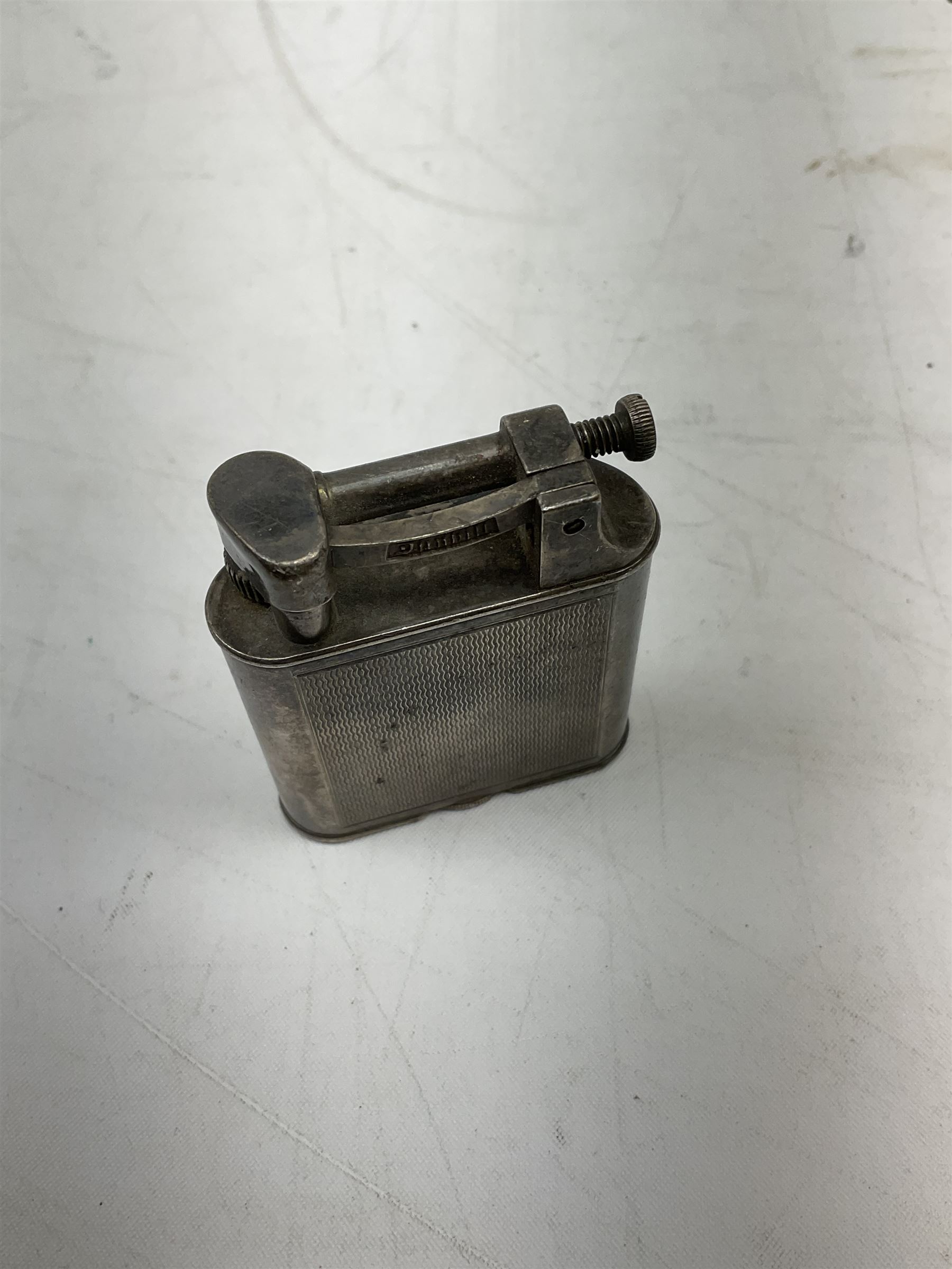 Dunhill silver plated lift-arm lighter, of rectangular form with engine turned decoration, signed Dunhill, base impressed Pat. No. 390107, H5cm