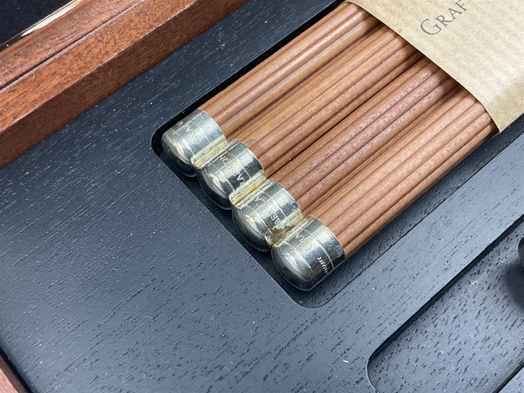 Graf Von Faber-Castell Pencil Cassette, housed in alder wood presentation box with mirrored hinged lid, containing platinum plated Perfect Pencil, sharpener, four erasers and four replacement pocket pencils with native alder handles hand-selected by Nuremberg woodcarvers, with certificate, cloth and original green box