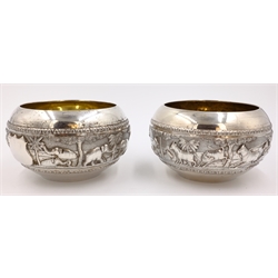  Set of four Indian silver bowls embossed pastoral and hunting scenes stamped A.Bhicajee & Co Bombay silver, 13cm diameter approx 16oz  