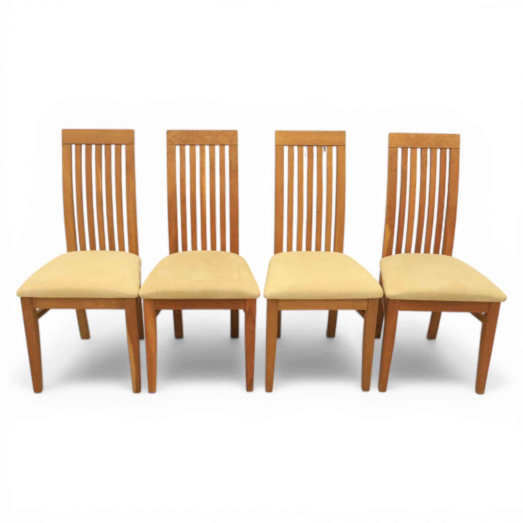 Contemporary teak dining suite comprising extending table and eight chairs, the table with rectangular plank top and one additional leaf extending to 210cm, supported on square tapering legs, the chairs with tall slatted backs and cream upholstered seats