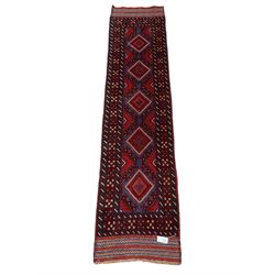 Meshwani red and blue ground runner, decorated with repeating lozenge medallions, overall geometric design