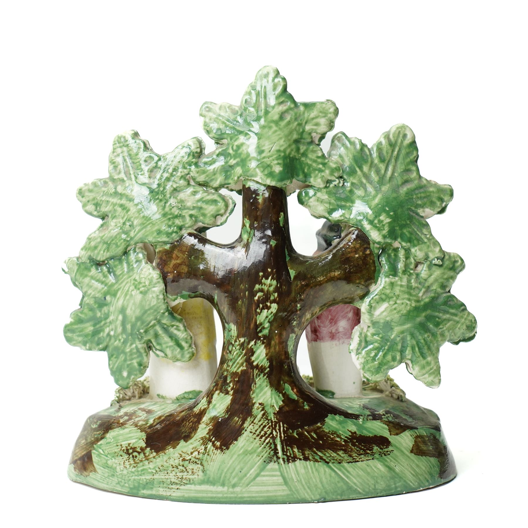 Pair of 19th century Staffordshire sheep, W13cm; together with a pearlware bocage group, H12cm (3)