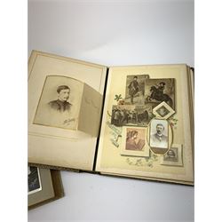Album containing two-hundred and thirty Edwardian and later postcards including real photographic and printed topographical with some of local interest to Lincolnshire and East Yorkshire, shipping, aviation, airships, glamour and actresses, horse racing etc; and a well stocked Victorian leather photograph album (2)
