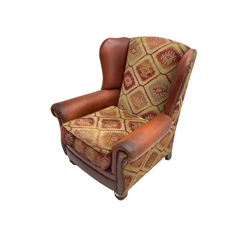 Wingback armchair, upholstered in studded red leather and kilim style fabric