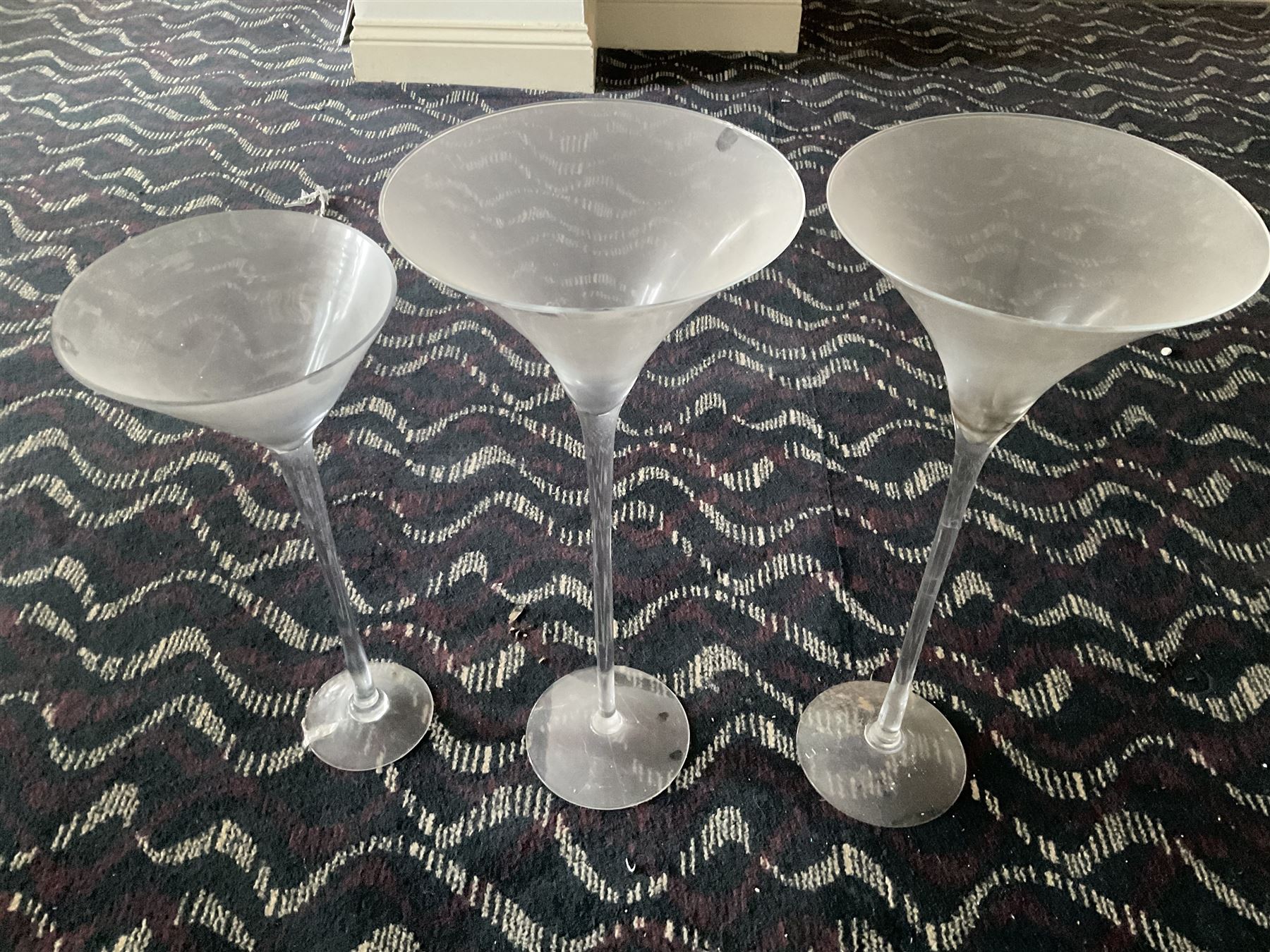 Three large glass ornamental wine flutes- LOT SUBJECT TO VAT ON THE HAMMER PRICE - To be collected by appointment from The Ambassador Hotel, 36-38 Esplanade, Scarborough YO11 2AY. ALL GOODS MUST BE REMOVED BY WEDNESDAY 15TH JUNE.