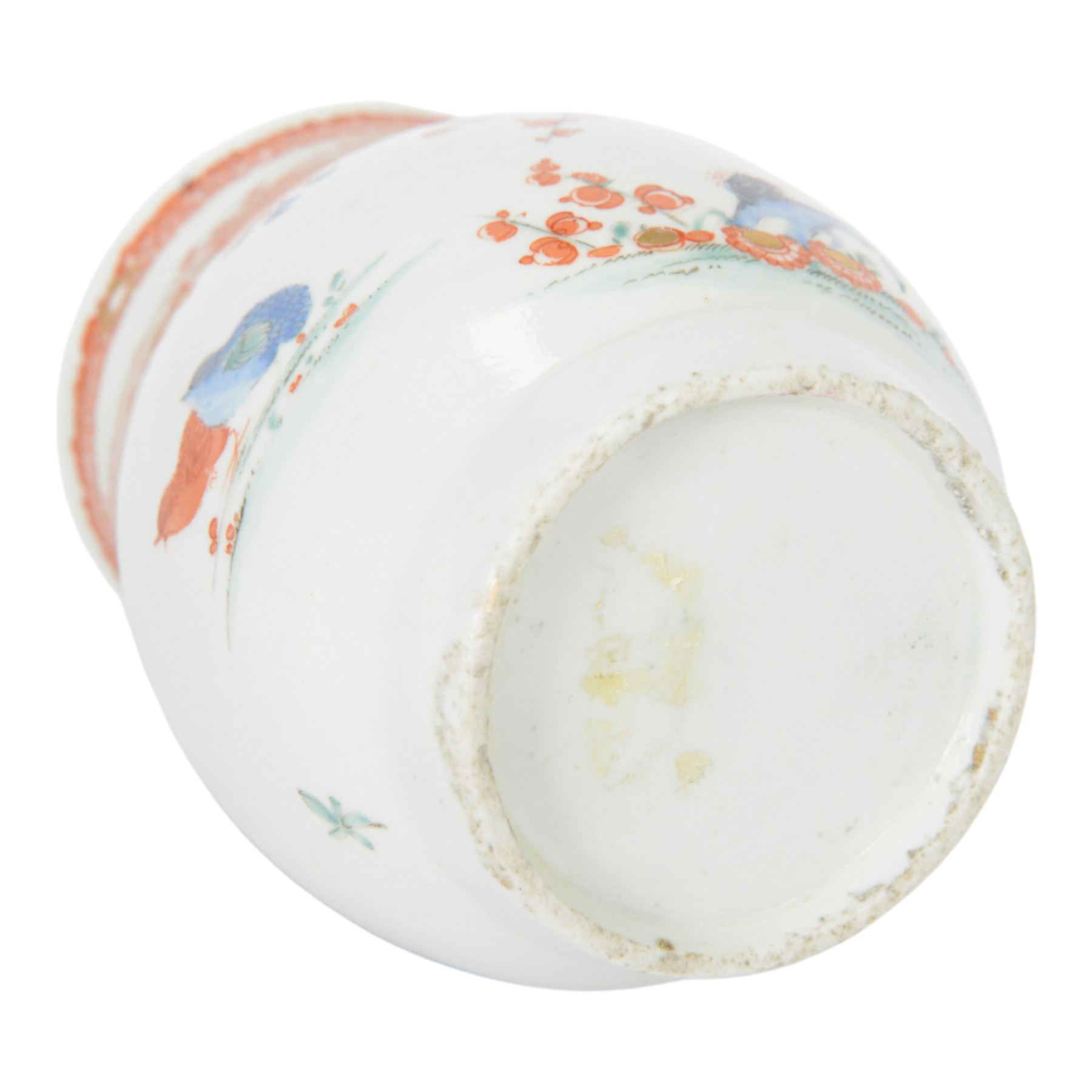 Mid 18th century Worcester mug, circa 1756-1758, of bell form with grooved loop handle, decorated in the Two Quail pattern in the Kakiemon palette with two birds and blossoming prunus trees amongst further flowers, sprigs and insects, bellow an iron red foliate border to rim, H12cm
