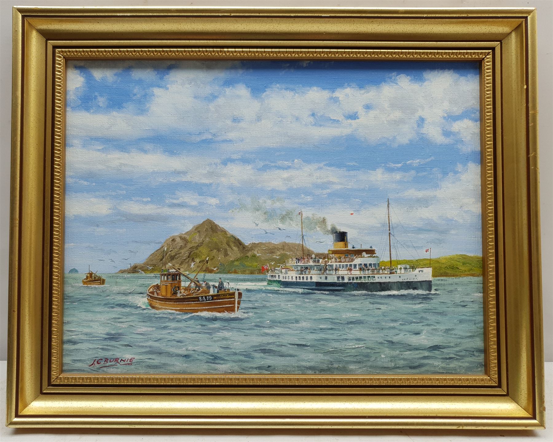 J C Burnie (British 20th century): Paddle Steamer Caledonia off Holy Isle, oil on canvas signed 29cm x 39cm