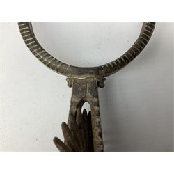 Pair of late 19th century South American iron spurs, engraved silver mounts, with sunburst rowls