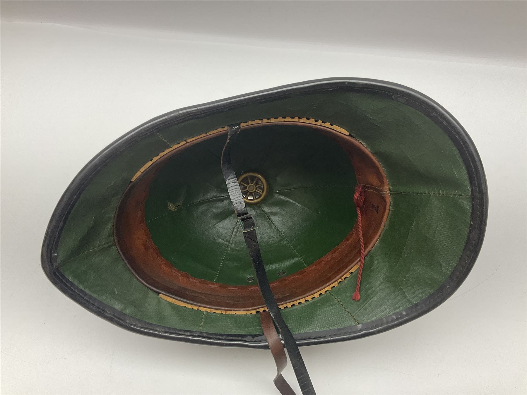 Police - Victorian turned hardwood truncheon with traces of decoration and VR cypher L42cm; Humberside Police helmet with Queens Crown helmet plate; hand lamp inscribed 'The Inspector'; and small pair of pewter figures of police officers (5)