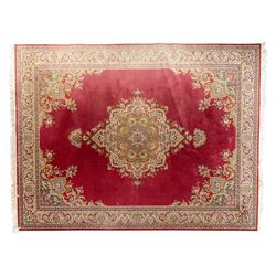 Kashan design carpet, crimson field with central medallion and scrolling floral sprays, cr...