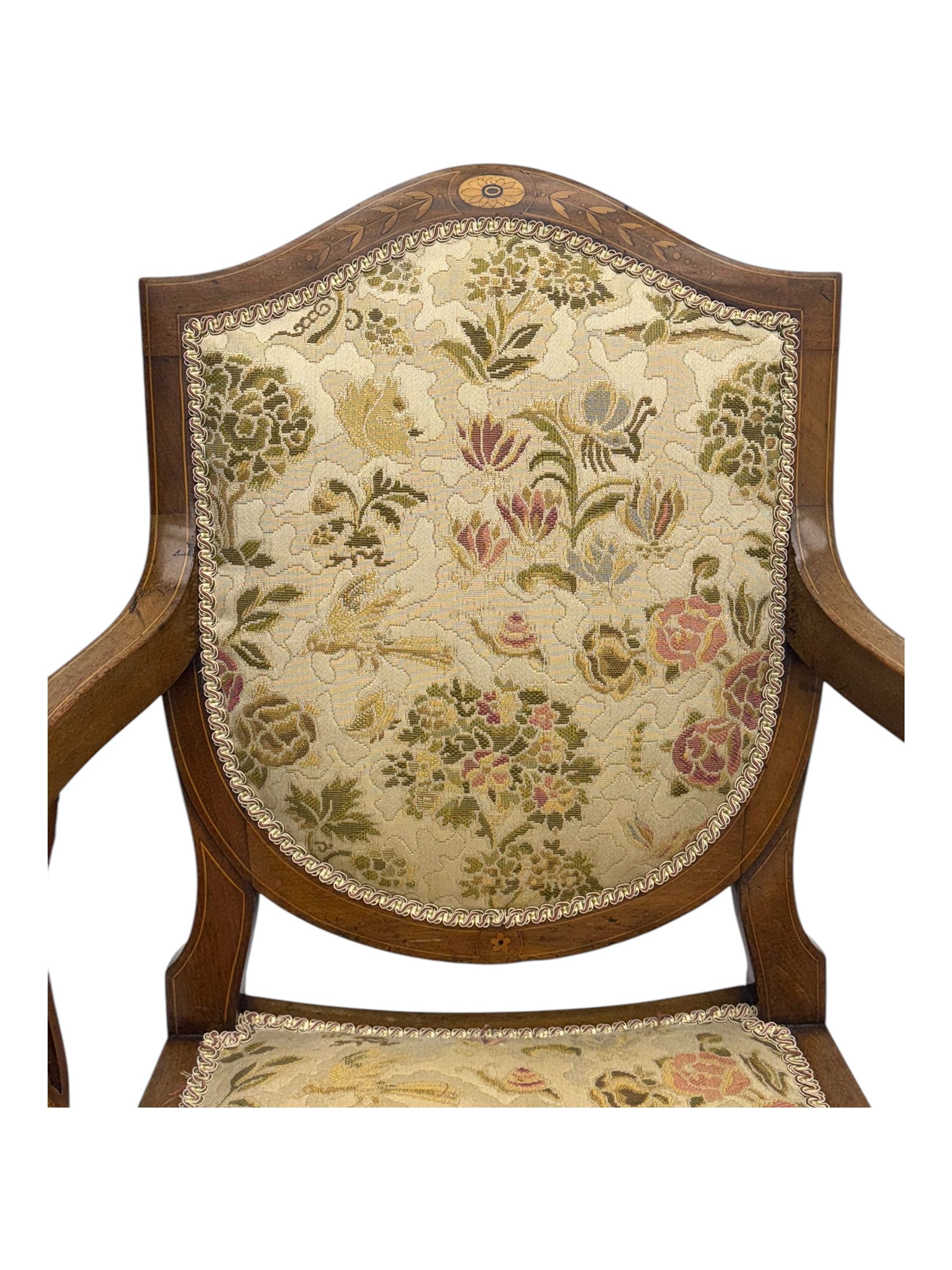 Edwardian inlaid mahogany X-frame armchair, upholstered seat and shield-back, curved front supports united by turned H-stretcher (W57cm, D58cm, H94cm); similar inlaid mahogany armchair, raised on cabriole supports united by cross-stretcher (W62cm, D60cm, H82cm) 