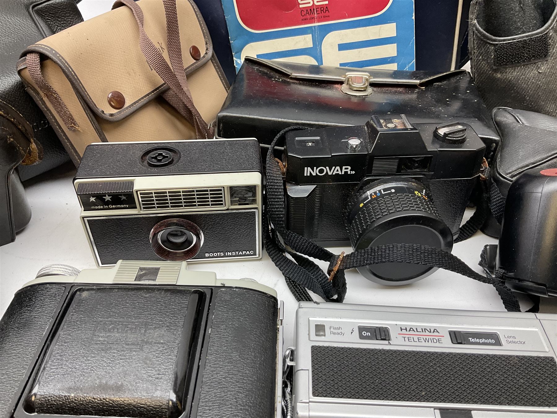 Quantity of Cameras , Lenses and Table Top Viewer- To be assessed 
Collection of cameras, lenses and photography equipment, to include Praktica EE2, Kowa SE, Kodak 66 model II, Inovar, lens Carl Zeiss Jena DDR Flektogon 2.4/35, lens Pentacon Electric f/2.8 135mm, Sunpak auto 2020, tripod  etc, together with a pair of Mark Scheffel 10x50 field binoculars.  